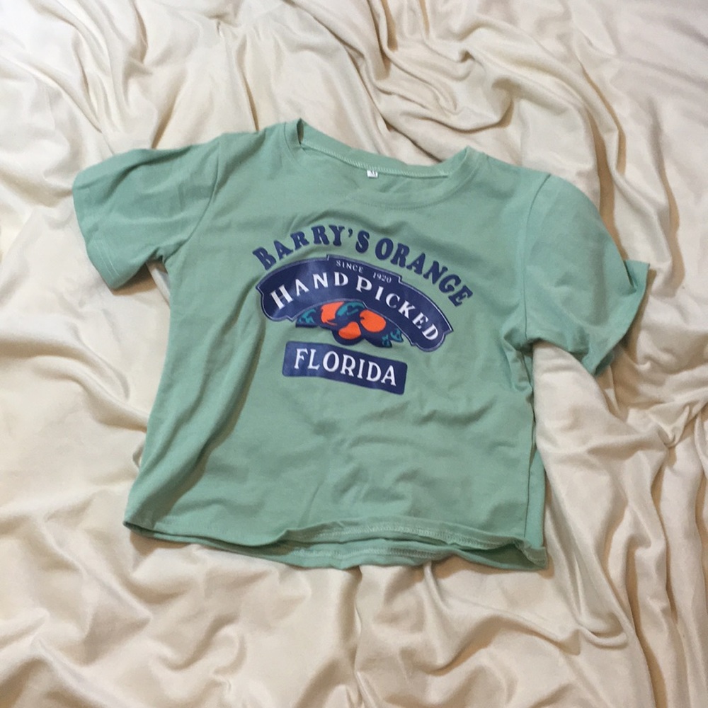 light green, short sleeved shirt, never been worn